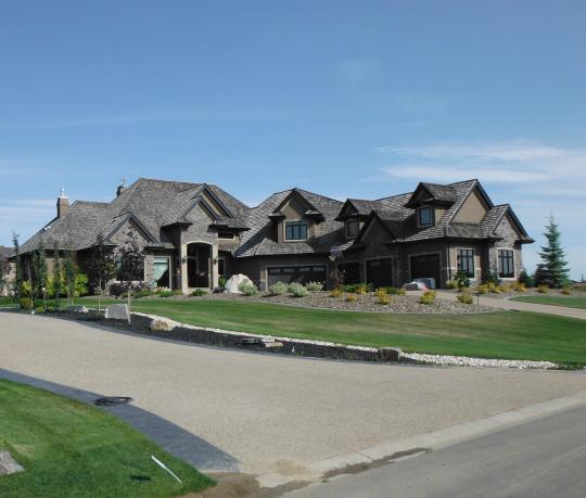 Large expensive houses, perfectly manicured, in the estates area.  I'm sure that the 5-car garage is bigger than my house!